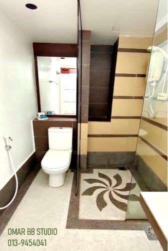 a bathroom with a toilet and a shower at OMAR BB STUDIO in Kota Bharu