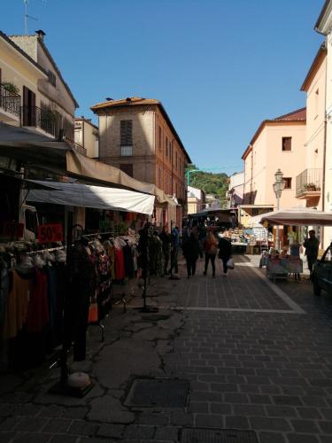 a group of people walking through an outdoor market at Casa Martin , 4 bedroom villa in Bisenti