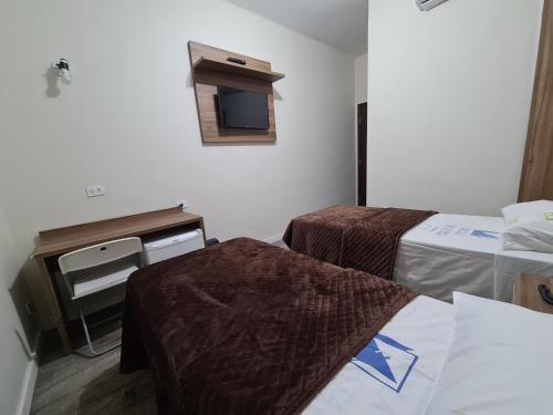 Ένα ή περισσότερα κρεβάτια σε δωμάτιο στο Bella Augusta Hotel