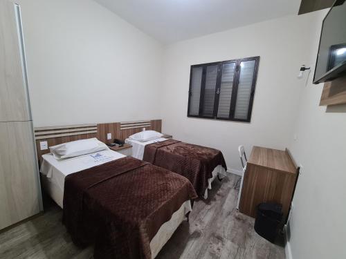 Ένα ή περισσότερα κρεβάτια σε δωμάτιο στο Bella Augusta Hotel