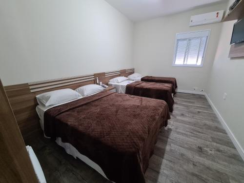 Ένα ή περισσότερα κρεβάτια σε δωμάτιο στο Bella Augusta Hotel