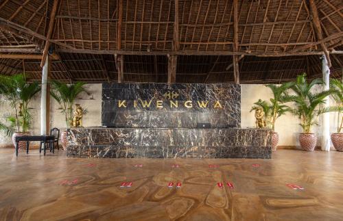 a room with a dance floor with a sign on the wall at Kiwengwa Beach Resort in Kiwengwa