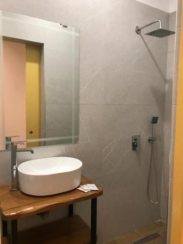 a bathroom with a sink and a shower at Foleza - Bed and breakfast in Vlorë
