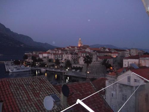 a view of a city at night with buildings at Guesthouse Franica in Korčula