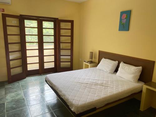 Ліжко або ліжка в номері Ilhabela Casa com Piscina