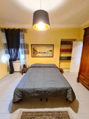 a bedroom with a large bed in a room at B&B Al Calcandola in Sarzana