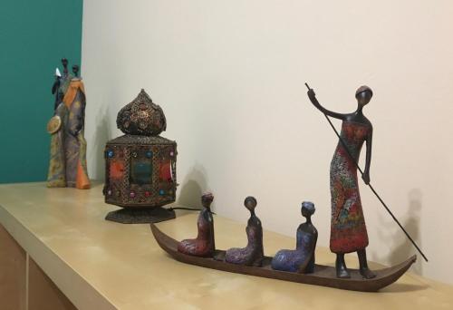 a statue of a woman on a boat with a group of people at LOS FRAILES I in San Sebastián de la Gomera