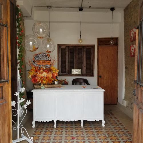 a white desk in a room with a window at Casa Ensueño Hogar Boutique in Guaduas