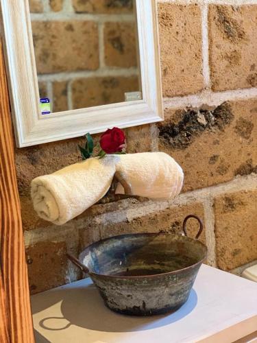 a mortar and pestle on a brick wall next to a mortar at Quinta María Victoria in Bernal