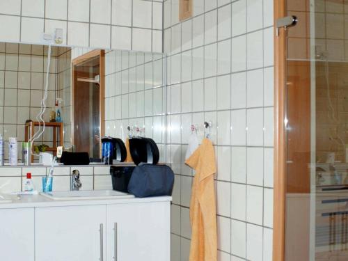 a bathroom with a sink and a mirror at Six-Bedroom Holiday home in Eidsvåg in Eidsvåg