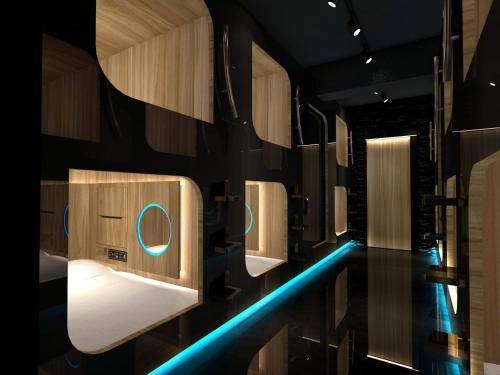 a bathroom with a row of toilet paper dispensers at The Nap Tsim Sha Tsui in Hong Kong