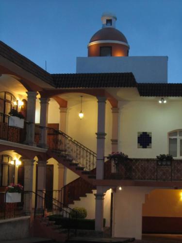 a building with a lighthouse on top of it at Hotel Colonial in Teziutlán