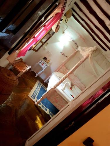an aerial view of a kitchen with a bed in a room at Boutique Hotel Nyumbani Tembo in Watamu