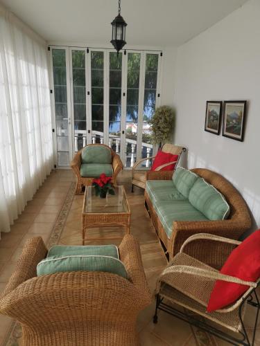 a living room with couches and chairs and a table at CASA rural DOLORES en Adeje in Adeje
