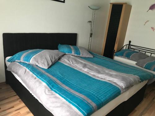 a bed with two pillows on top of it at Ferienwohnung in Neunkirchen