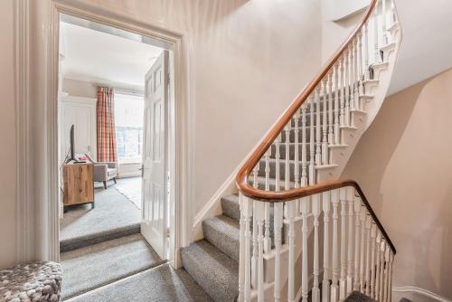 a staircase in a home with white walls at Great Gate House View, Micklegate near York Station in York