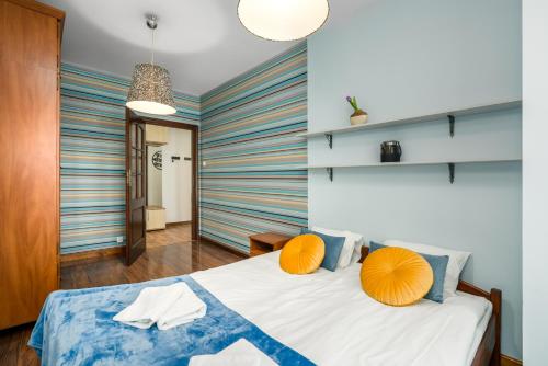Posteľ alebo postele v izbe v ubytovaní Sleepway Apartments- Szyperska