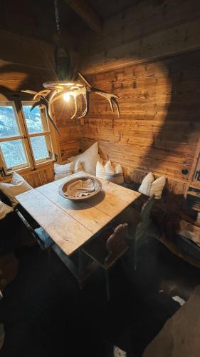 a wooden room with a wooden table in a room at Berghütte Wattenberg in Wattenberg