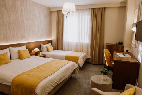 Un ou plusieurs lits dans un hébergement de l'établissement Hotel Kapri