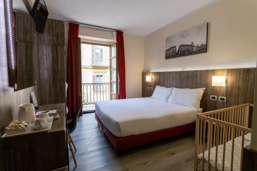 Postel nebo postele na pokoji v ubytování Hotel Urbani