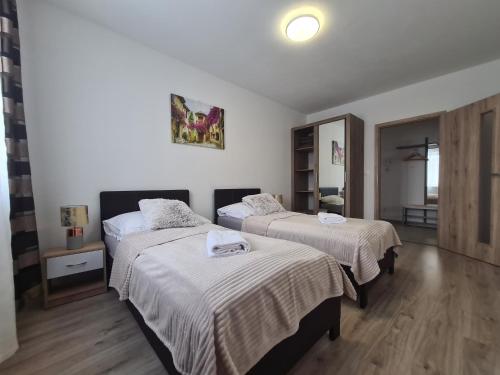 Postel nebo postele na pokoji v ubytování Apartmány Šafrán