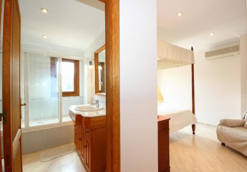 a bathroom with a sink and a bunk bed at Casa Cristòfol in Campanet