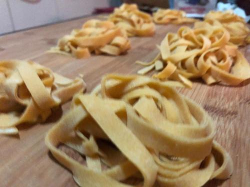 a wooden cutting board with wontons on a cutting board at Villa Dacia in Guiglia