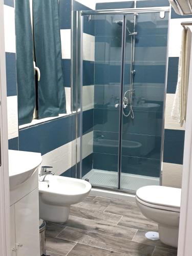 a bathroom with a shower and a sink and a toilet at B&B HERCULANEUM RUINS in Ercolano