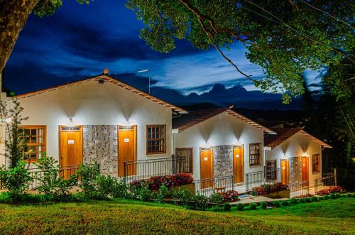 a house at night with lights on at Pousada Vila Catarina in Ouro Preto