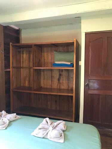 a room with a bed with two towels at Papa Pippo Otres Village in Sihanoukville