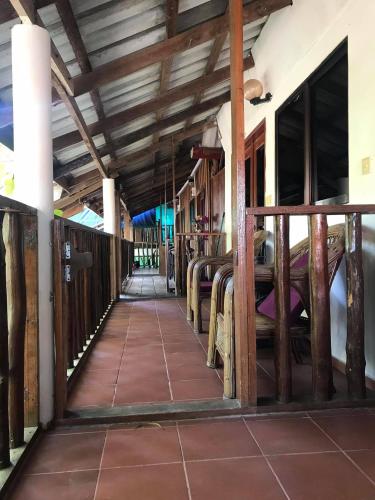 a corridor of a building with wooden beams at Papa Pippo Otres Village in Sihanoukville