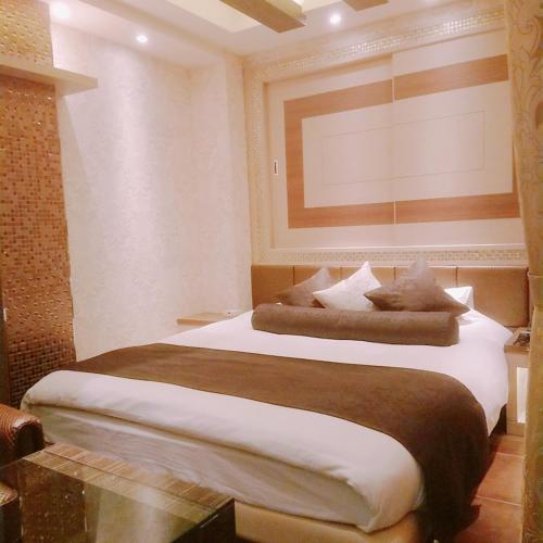 Katil atau katil-katil dalam bilik di Hotel Lei