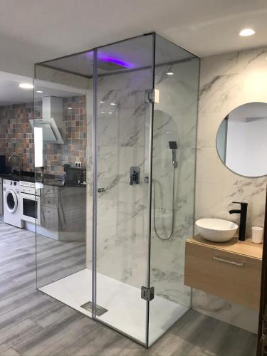 a bathroom with a glass shower with a sink at Sensaciones in Anna