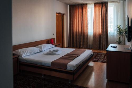 En eller flere senger på et rom på HOTEL K2 CITY