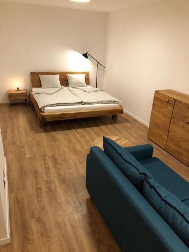 a living room with a bed and a couch at Apartmán Janina in Janov nad Nisou