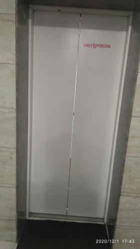 a white garage door with a sign on it at Hotel Popular in Amritsar
