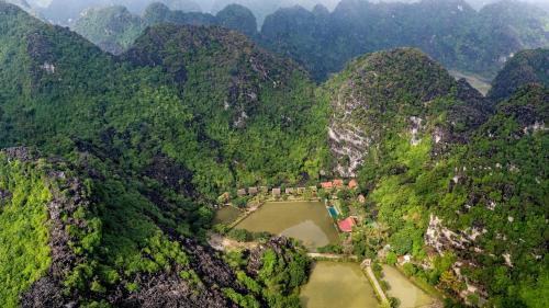 an aerial view of a mountain valley with a river at An's Eco Garden Resort in Ninh Binh