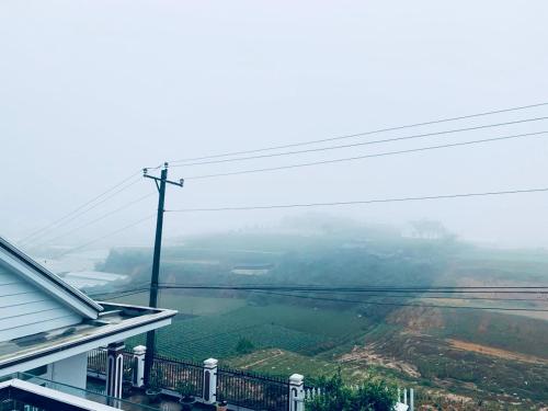 a view of a river from a balcony of a house at November Villa Đà Lạt in Da Lat
