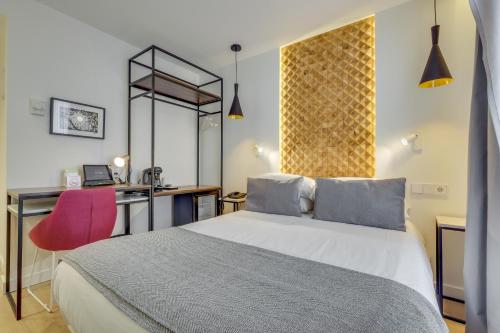 Ένα ή περισσότερα κρεβάτια σε δωμάτιο στο Hotel Beausejour
