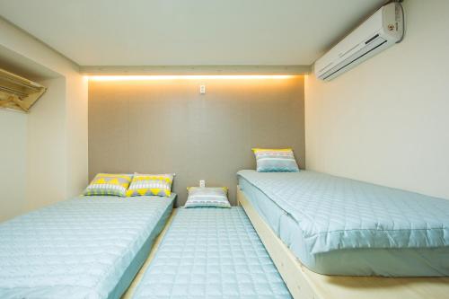 Кровать или кровати в номере Guesthouse The Hill