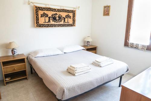 A bed or beds in a room at Casetta Delle Allodole