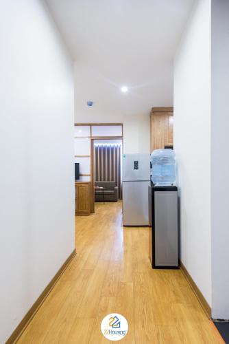 an empty room with a refrigerator and a kitchen at 22Housing luxury Hotel & Residence 39 Linh Lang in Hanoi
