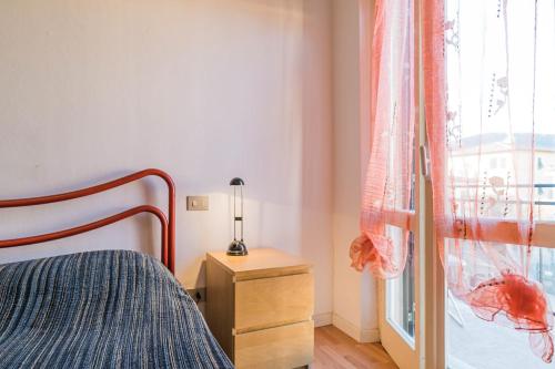 a bedroom with a bed and a window at Don Josè in Porto Azzurro