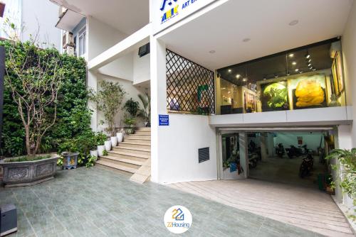 a building with a staircase in front of it at 22Housing luxury Hotel & Residence 39 Linh Lang in Hanoi