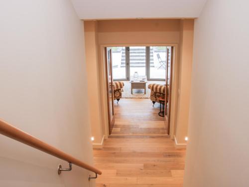 a hallway of a house with a stairway at Round House in Church Stretton