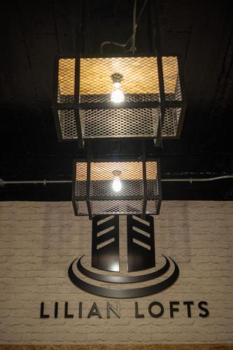 a chandelier hanging from the ceiling of a lilianoths sign at Lilian Lofts Hotel & Spa in Johannesburg