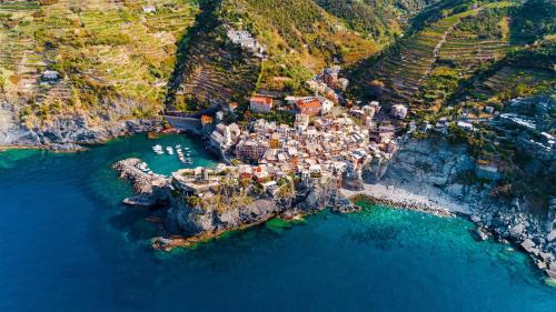 an aerial view of a village on a rocky island in the water at Cozy House in Castelnuovo di Garfagnana + Large Garden in Castelnuovo di Garfagnana