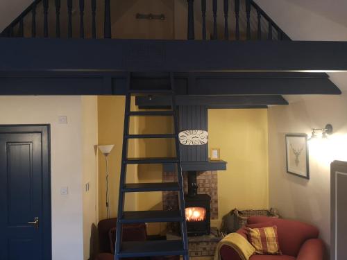 Łóżko lub łóżka piętrowe w pokoju w obiekcie Private Cottage Bothy near Loch Lomond & Stirling