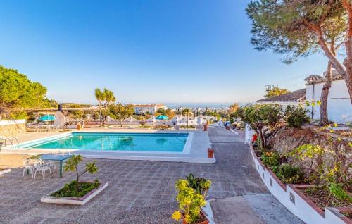 a villa with a swimming pool in a resort at Exceptional villa in Mijas with private pool, sea view in Mijas