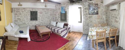 a living room with a couch and a table at Comfortable Apartment in Betina, terrace, 55 m², air-conditioned in Betina